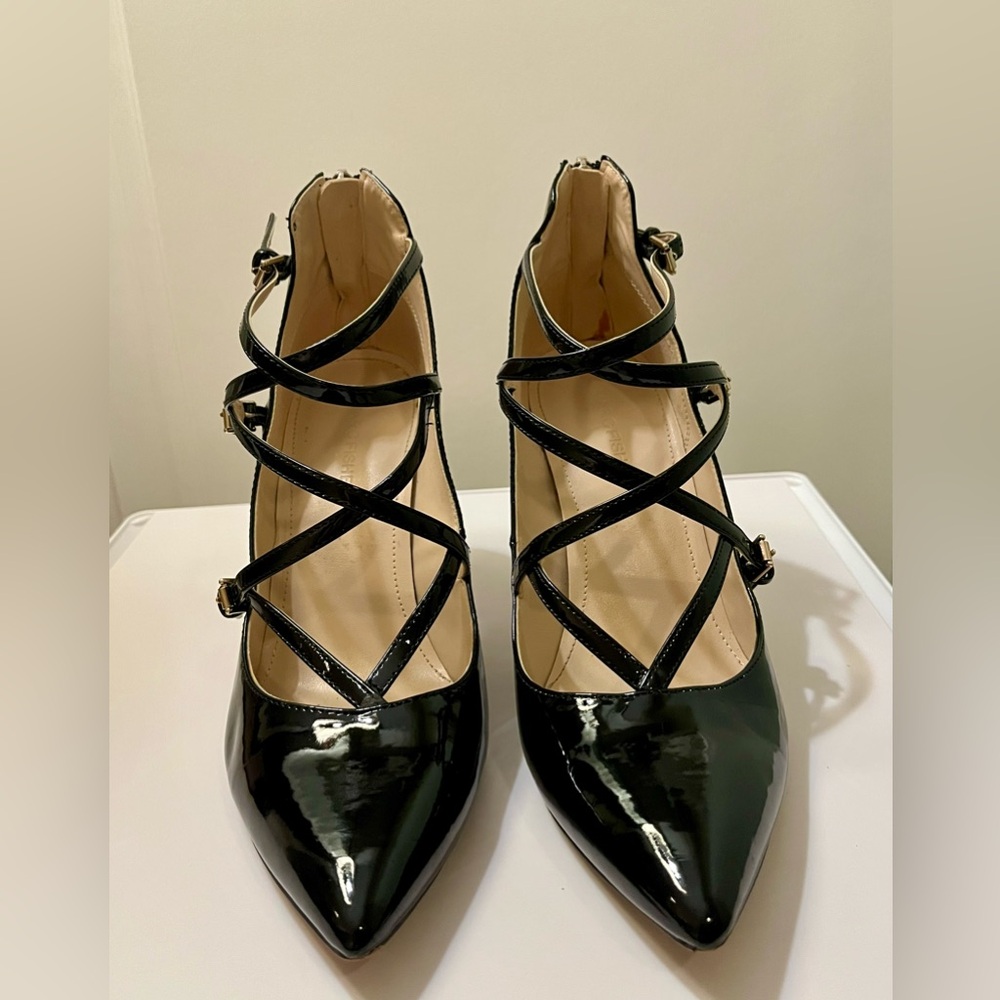 Black Patten Leather heels size 8 crisscross buckle pattern with zipper backs.